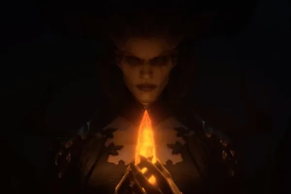 Um personagem de Diablo 4 olhando para uma chama aberta